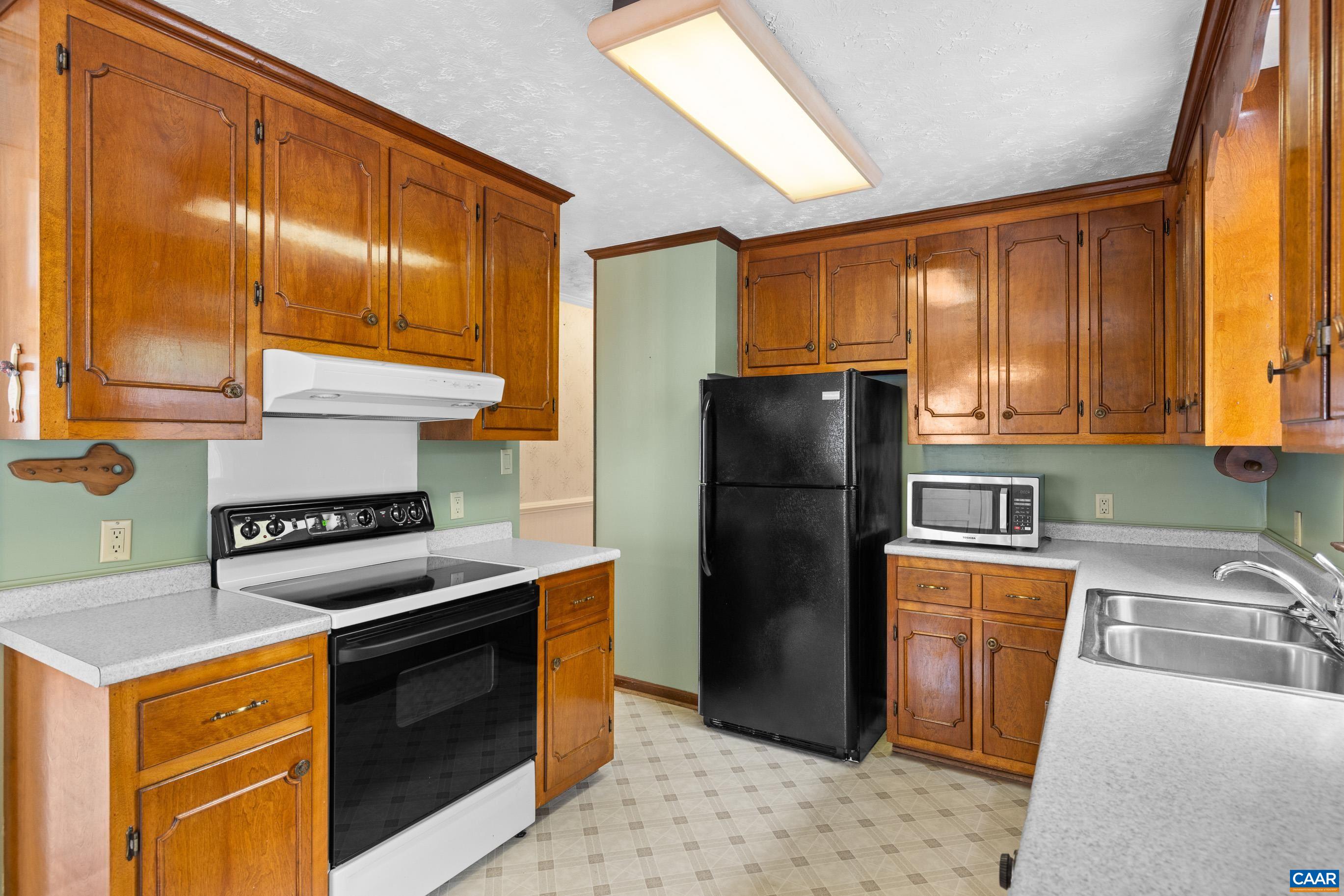 408 Carlton Road Charlottesville, VA 22902 - Photo 20 of 28 a kitchen with stainless steel appliances granite countertop a refrigerator a stove a sink and dishwasher