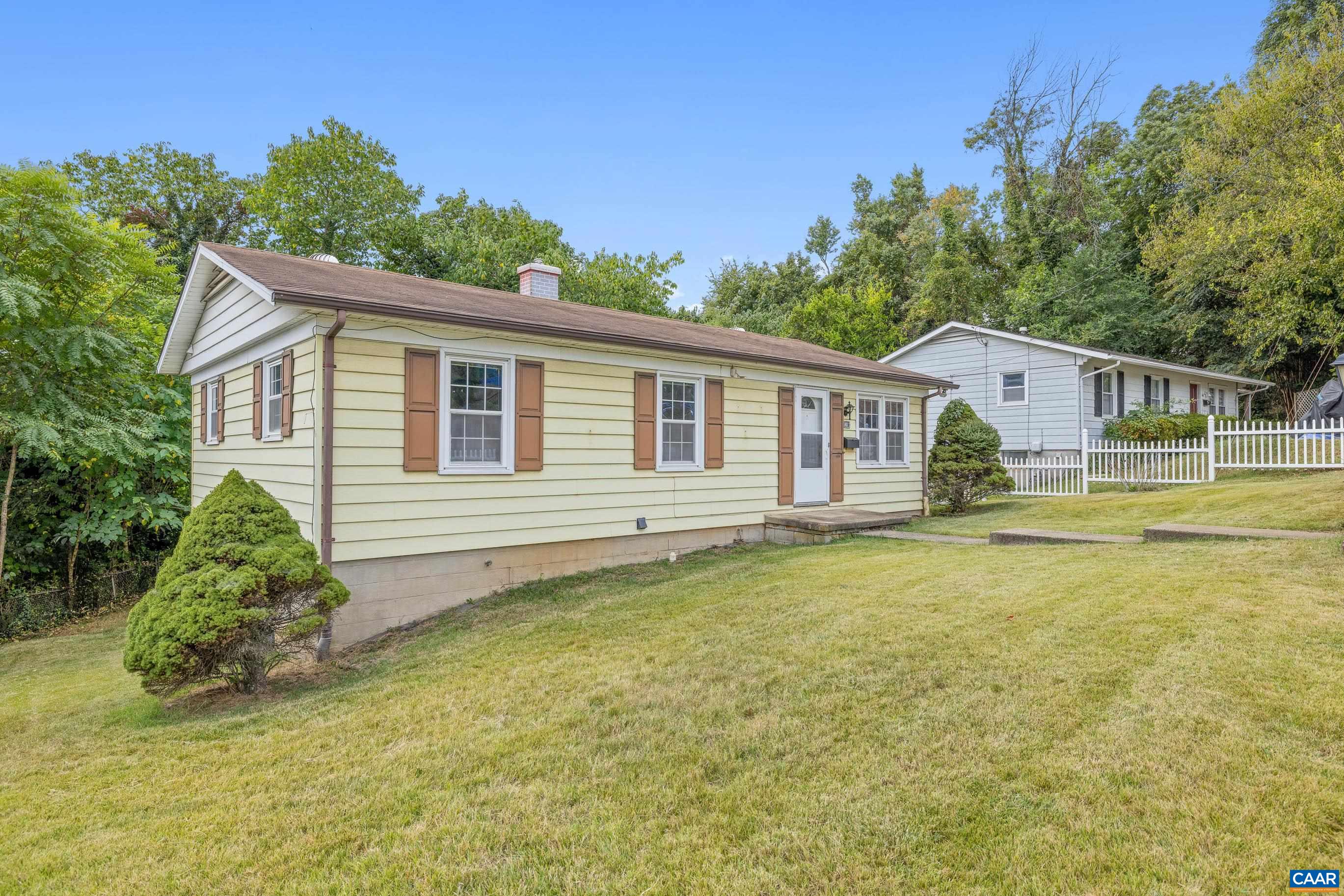 408 Carlton Road Charlottesville, VA 22902 - Photo 3 of 28 a front view of a house with a garden