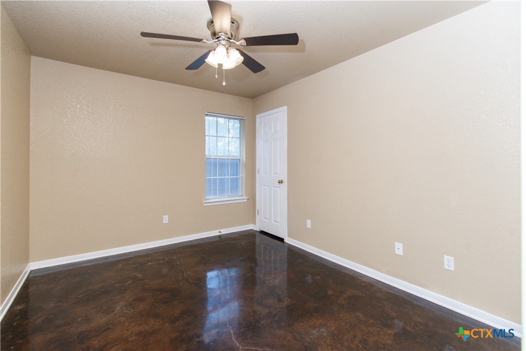 1611 Ute Trail, Unit A Harker Heights, TX 76548 - Photo 12 of 20 an empty room with wooden floor fan and windows