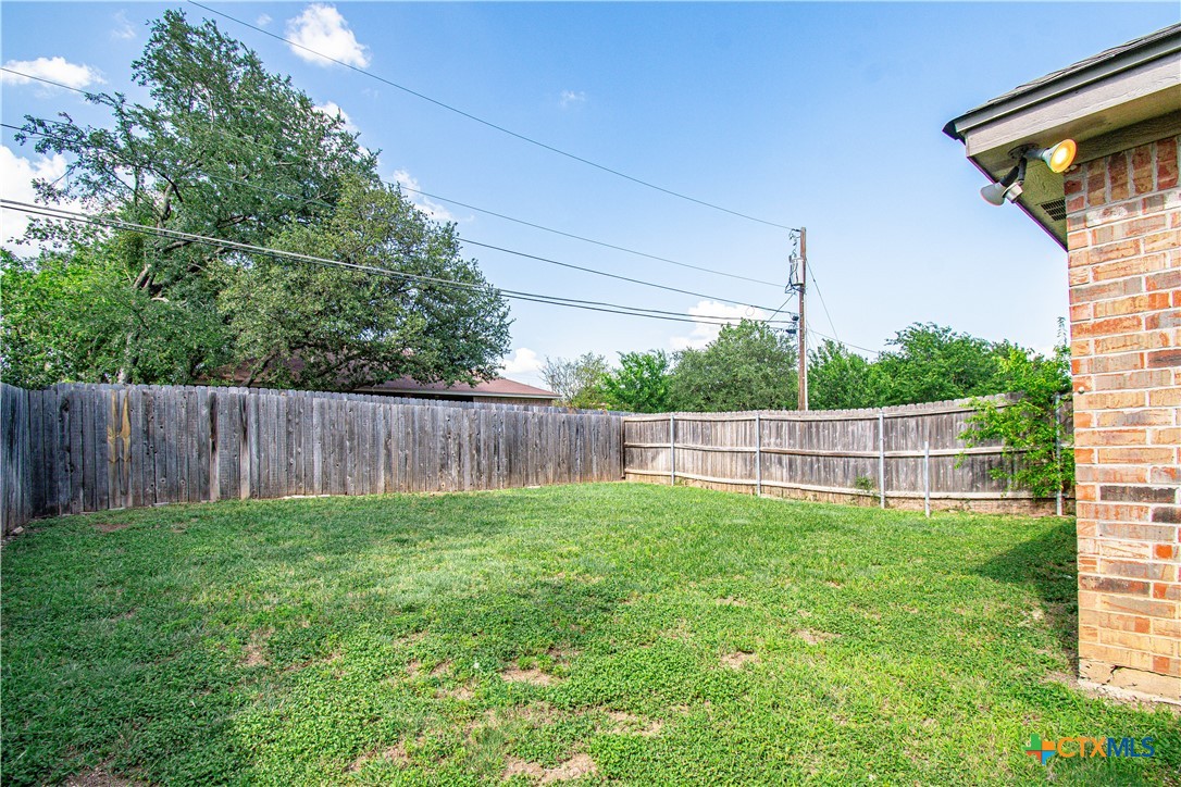 1611 Ute Trail, Unit A Harker Heights, TX 76548 - Photo 20 of 20 a view of a backyard with a wooden fence and a fence