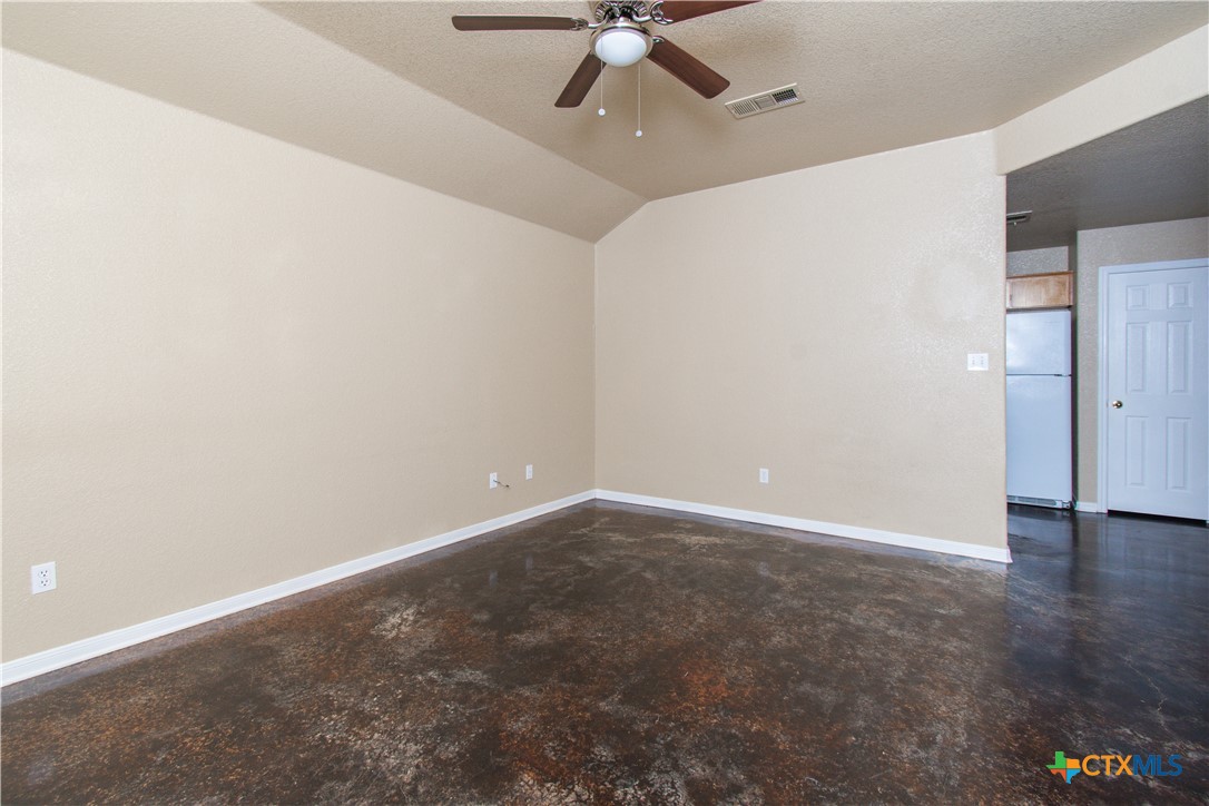 1611 Ute Trail, Unit A Harker Heights, TX 76548 - Photo 2 of 20 an empty room with a ceiling fan and carpet