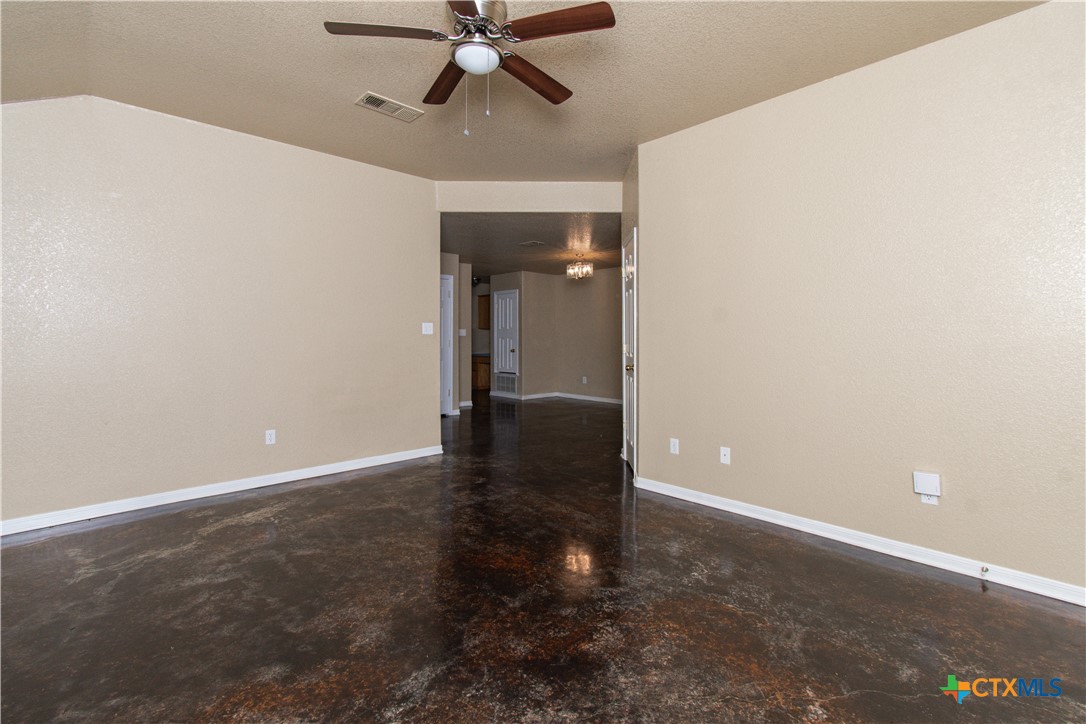 1611 Ute Trail, Unit A Harker Heights, TX 76548 - Photo 3 of 20 an empty room with closet and a chandelier fan