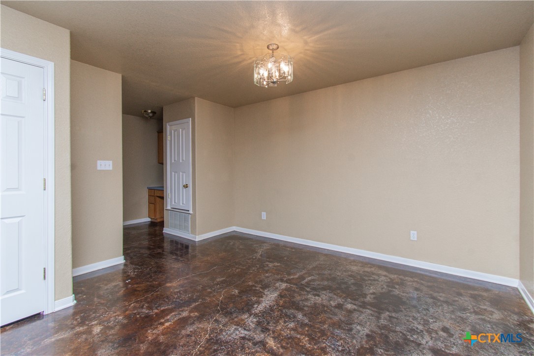 1611 Ute Trail, Unit A Harker Heights, TX 76548 - Photo 5 of 20 a view of an empty room with a chandelier fan