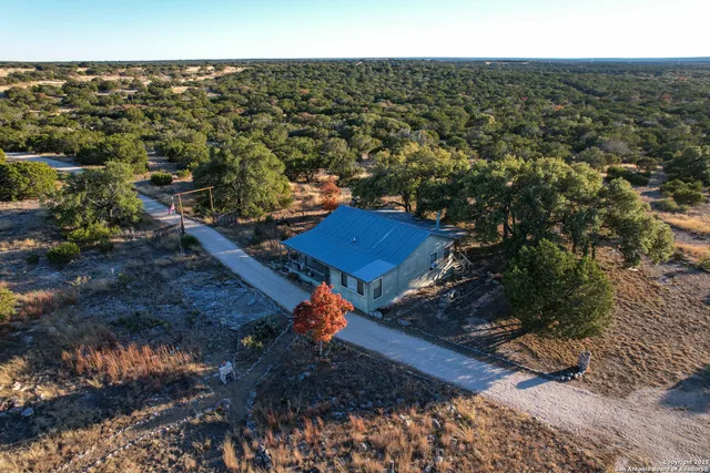an aerial view of residential building and ocean