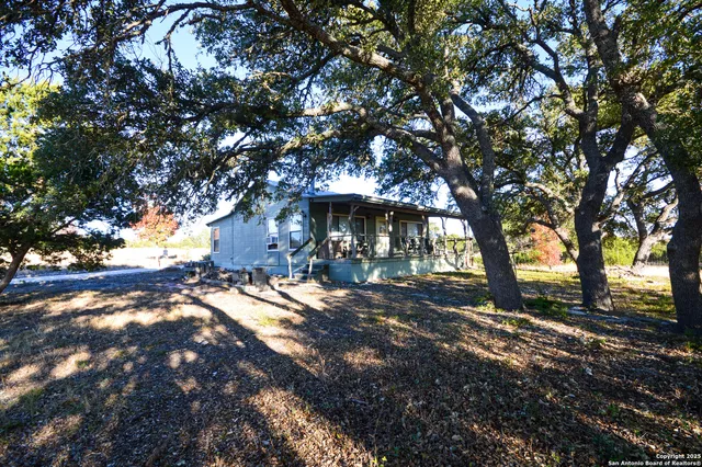 a view of a porch with wooden floor