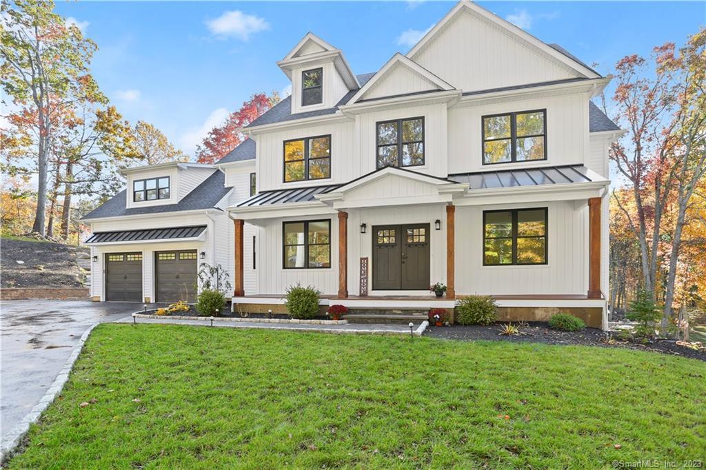 front view of a house with a yard