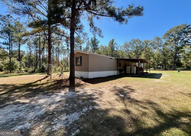 a backyard of a house with lots of green space