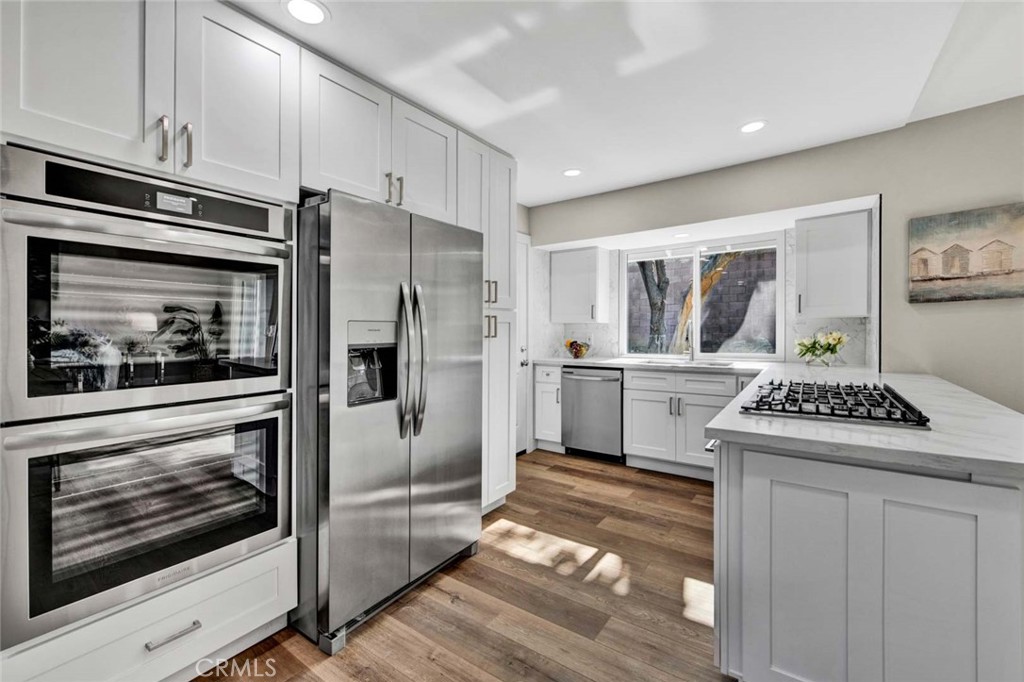 1798 Moorpark Drive Brea, CA 92821 - Photo 1 of 71 a kitchen with stainless steel appliances a stove a refrigerator and cabinets