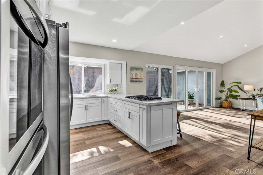 1798 Moorpark Drive Brea, CA 92821 - Photo 11 of 71 a kitchen with stainless steel appliances granite countertop a refrigerator a stove and a sink