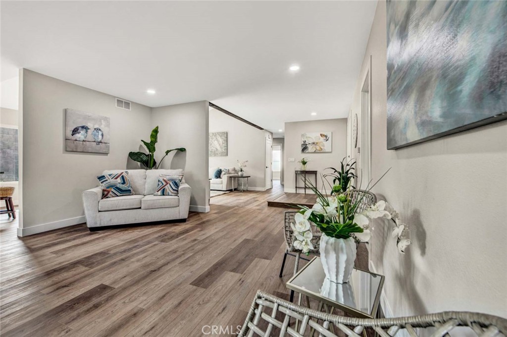 1798 Moorpark Drive Brea, CA 92821 - Photo 12 of 71 a living room with furniture and a chandelier