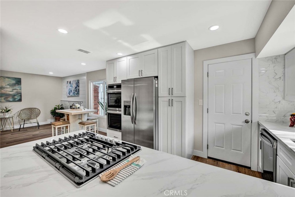 1798 Moorpark Drive Brea, CA 92821 - Photo 13 of 71 a kitchen with stainless steel appliances granite countertop a refrigerator and a stove top oven