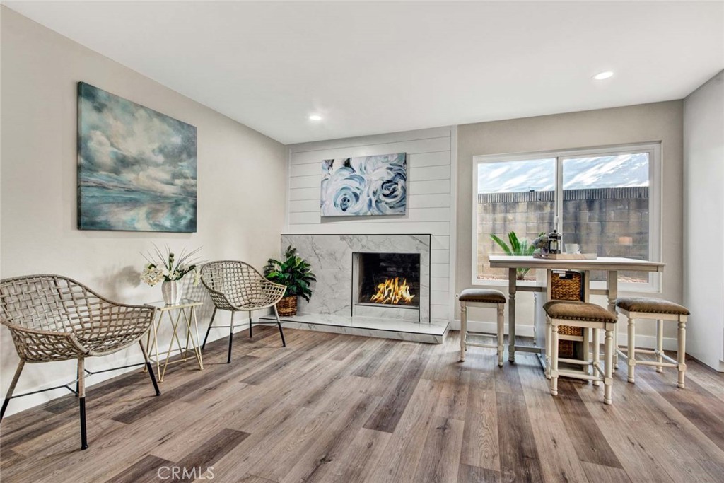 1798 Moorpark Drive Brea, CA 92821 - Photo 15 of 71 a living room with furniture a fireplace and a large window