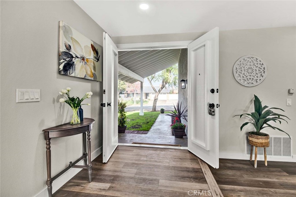 1798 Moorpark Drive Brea, CA 92821 - Photo 22 of 71 a view of a hallway with wooden floor and a potted plant