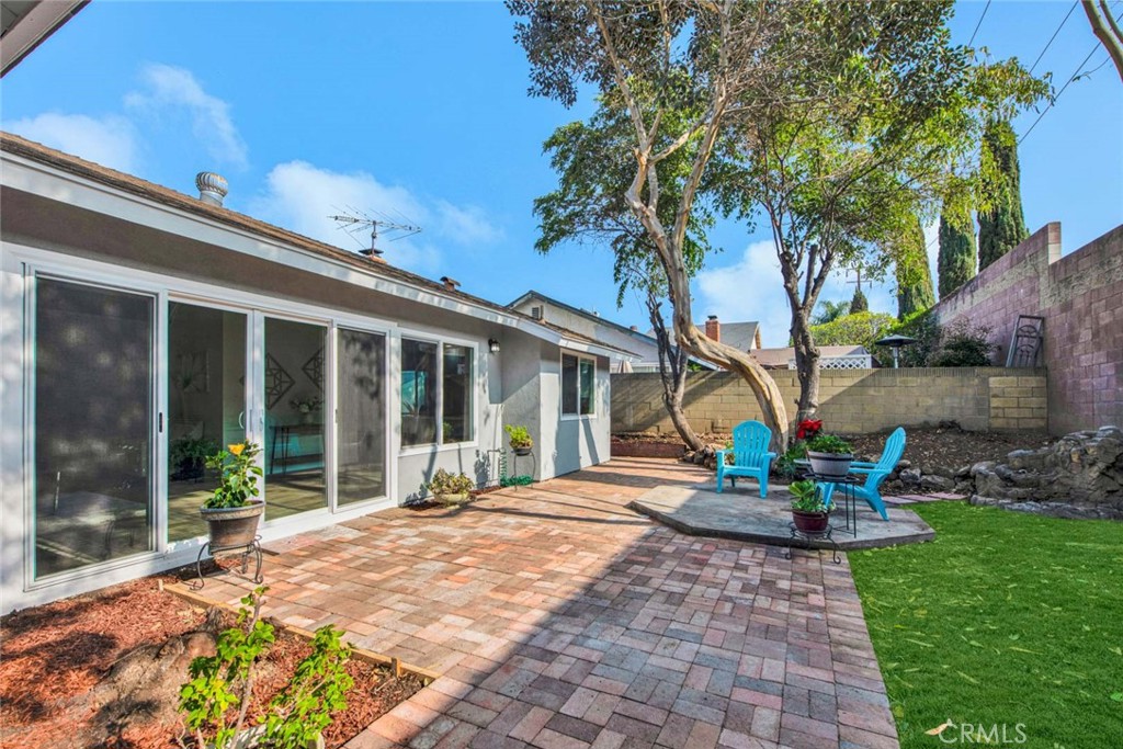 1798 Moorpark Drive Brea, CA 92821 - Photo 25 of 71 a front view of a house with a yard and potted plants