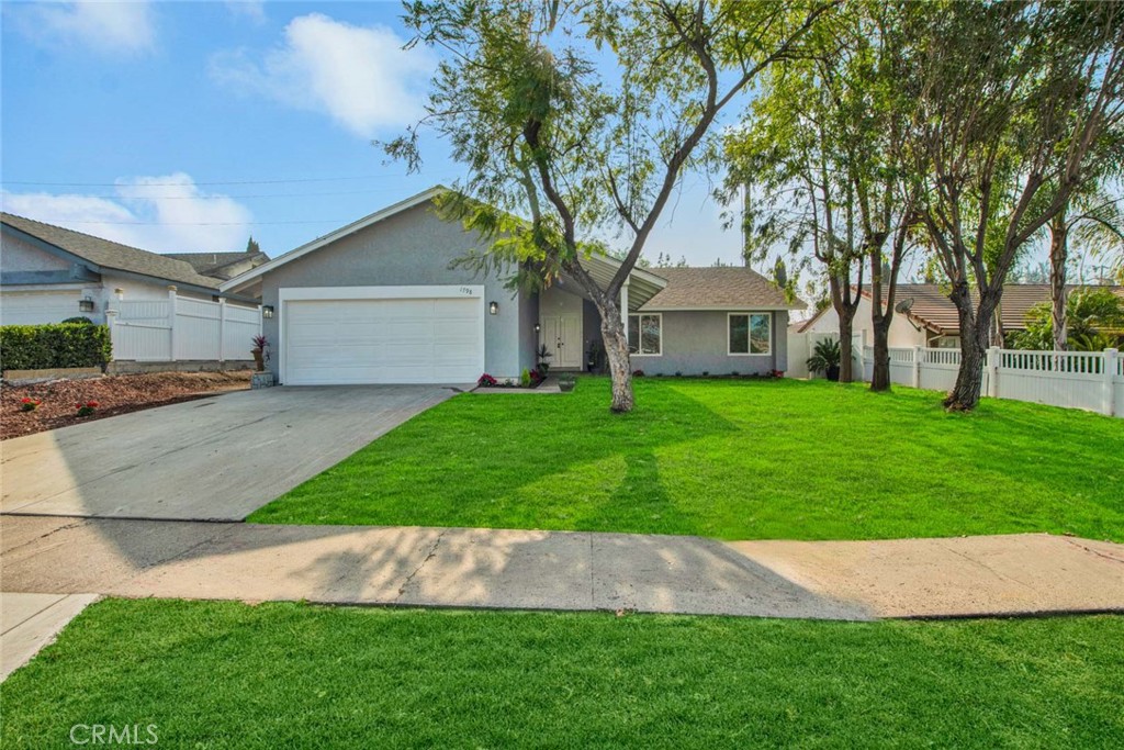 1798 Moorpark Drive Brea, CA 92821 - Photo 28 of 71 a front view of a house with a garden and yard