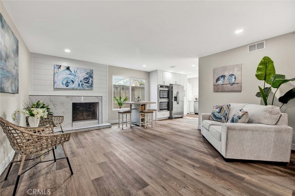 1798 Moorpark Drive Brea, CA 92821 - Photo 30 of 71 a living room with furniture and a fireplace