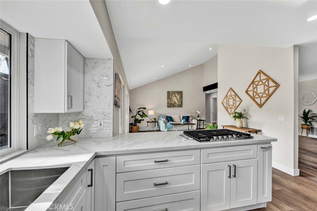 1798 Moorpark Drive Brea, CA 92821 - Photo 3 of 71 a kitchen with white cabinets and a stove