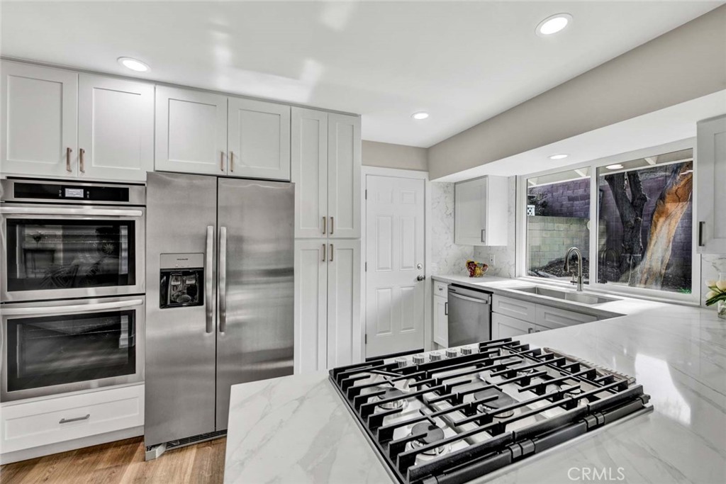1798 Moorpark Drive Brea, CA 92821 - Photo 31 of 71 a kitchen with stainless steel appliances a stove a sink and a refrigerator