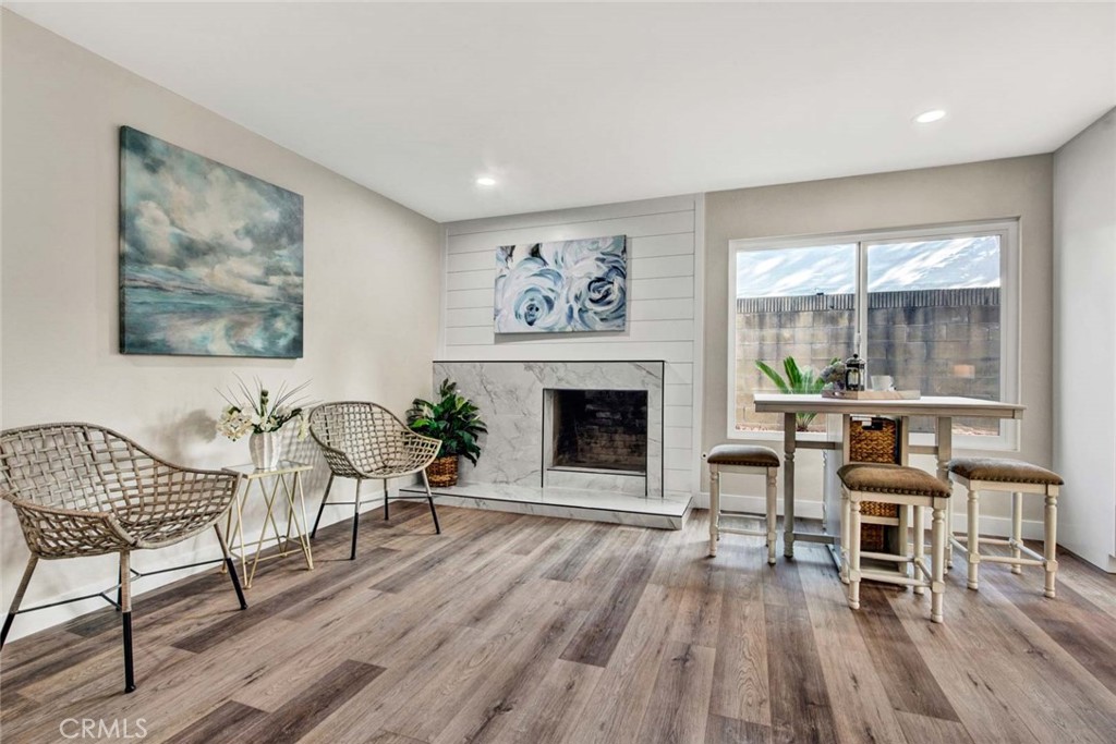 1798 Moorpark Drive Brea, CA 92821 - Photo 40 of 71 a living room with furniture a fireplace and a large window