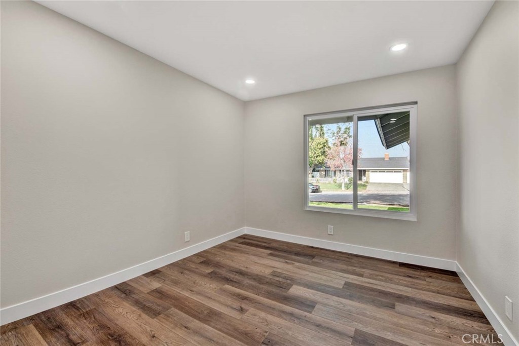 1798 Moorpark Drive Brea, CA 92821 - Photo 47 of 71 an empty room with wooden floor and windows