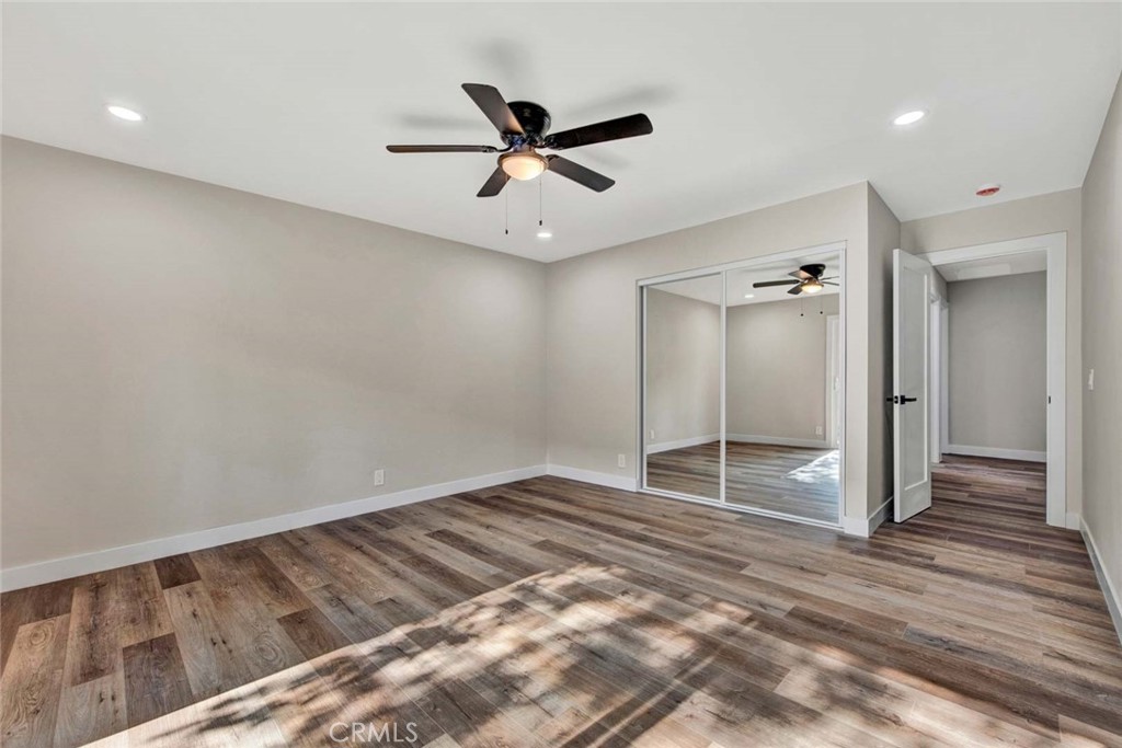 1798 Moorpark Drive Brea, CA 92821 - Photo 54 of 71 a view of empty room with wooden floor and ceiling fan
