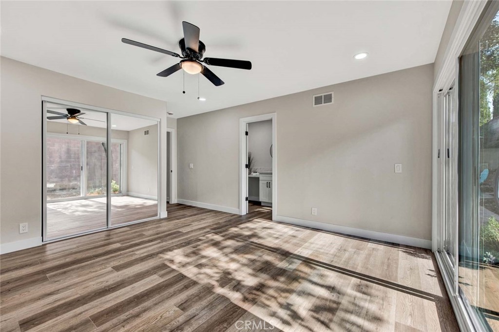 1798 Moorpark Drive Brea, CA 92821 - Photo 55 of 71 a view of empty room with wooden floor and fan