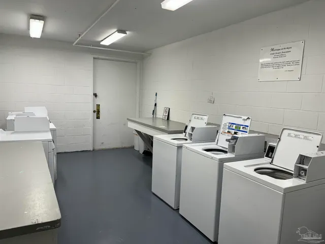 a view of storage and utility room with a washer dryer