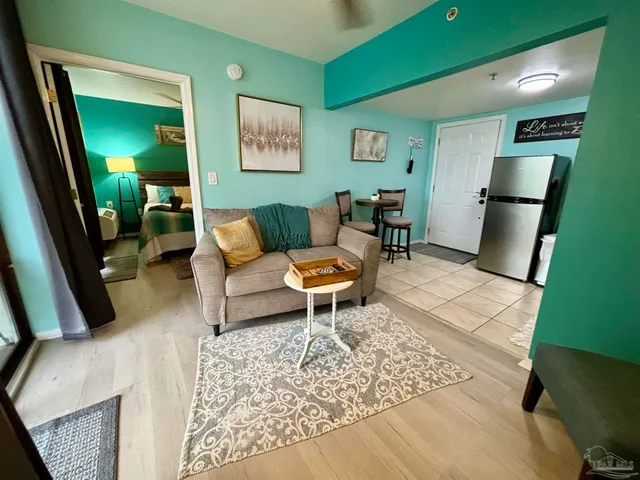 a living room with furniture and a rug