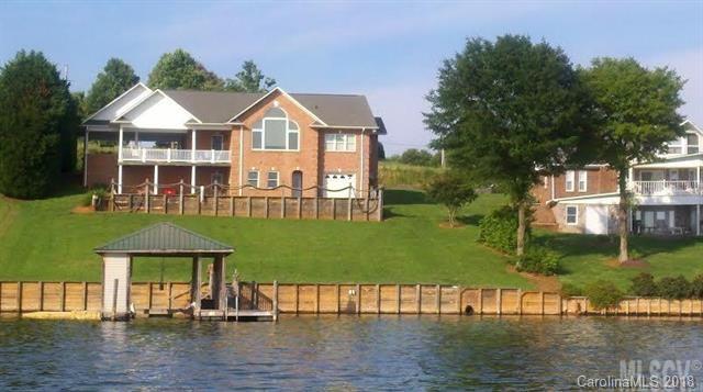 325 Kirkpatrick Road Taylorsville, NC 28681 - Photo 2 of 4 a front view of a house with a yard table and chairs