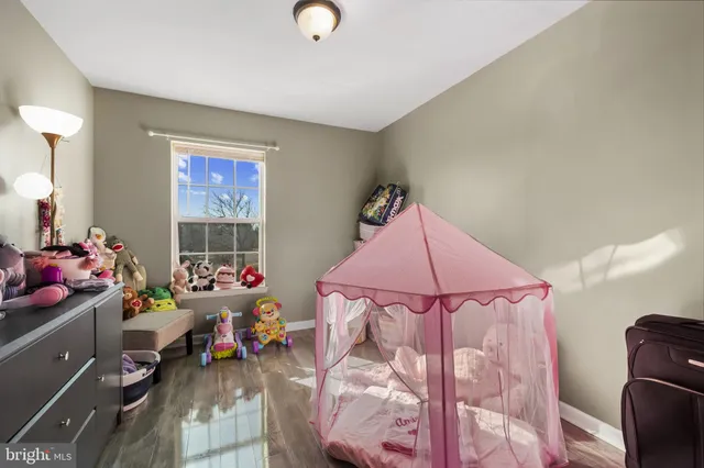 a bedroom with furniture and a chandelier