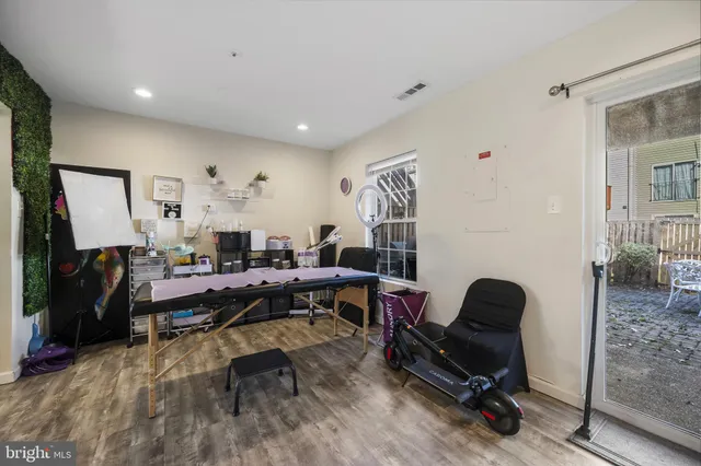 a living room with furniture a rug and a window