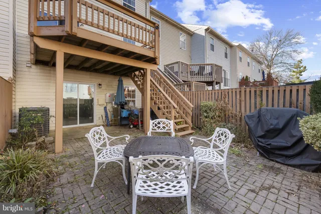 a view of a chair and tables in the patio