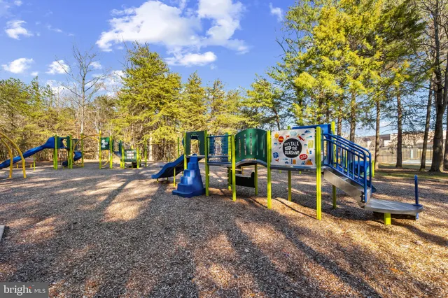 a view of a park with swings and slides