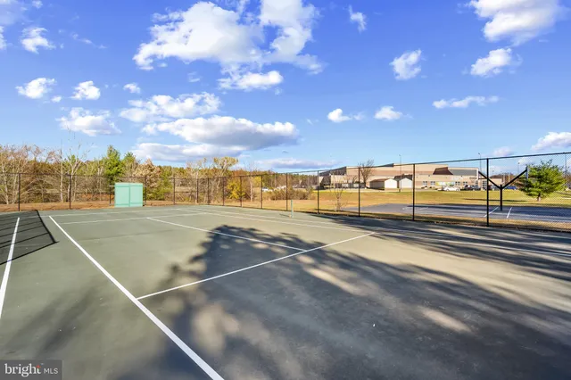 a view of swimming pool with outdoor seating