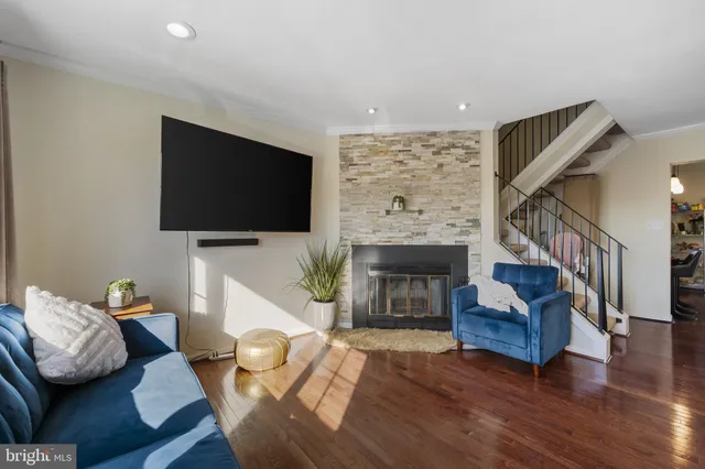 a living room with furniture fireplace and flat screen tv