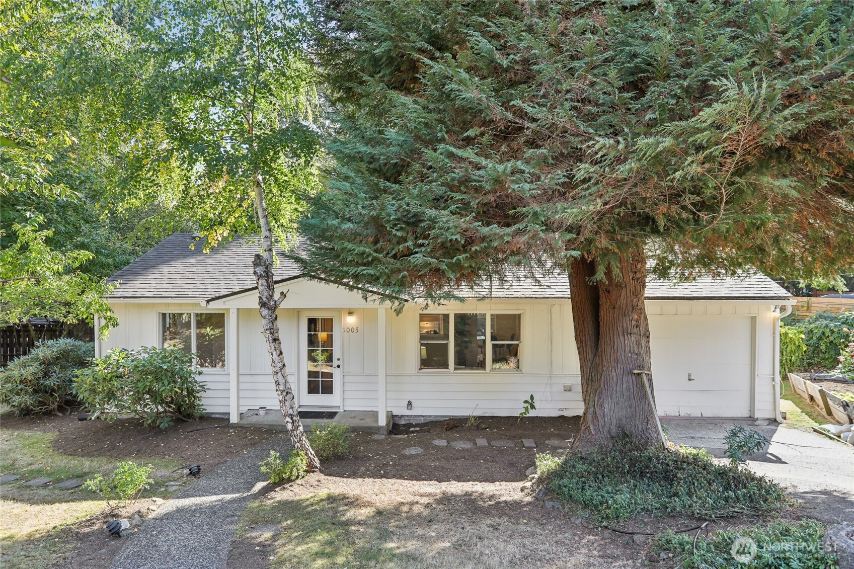 1005 Northeast 170th Street Shoreline, WA 98155 - Photo 1 of 35 a front view of a house with garden