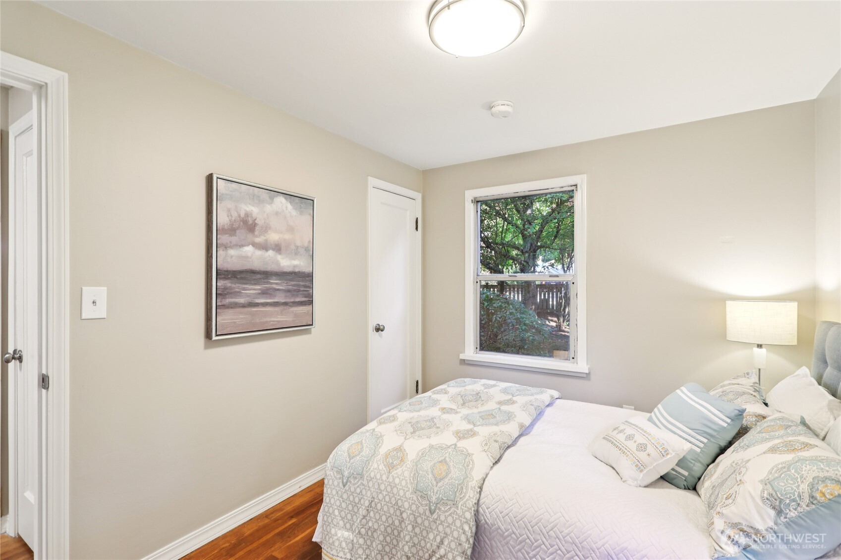 1005 Northeast 170th Street Shoreline, WA 98155 - Photo 13 of 35 a bedroom with a bed and a window