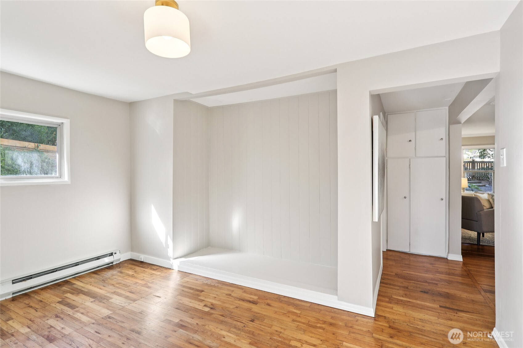 1005 Northeast 170th Street Shoreline, WA 98155 - Photo 17 of 35 an empty room with wooden floor and windows