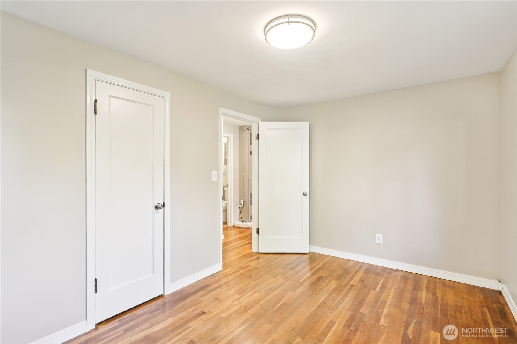 1005 Northeast 170th Street Shoreline, WA 98155 - Photo 20 of 35 a view of an empty room and wooden floor
