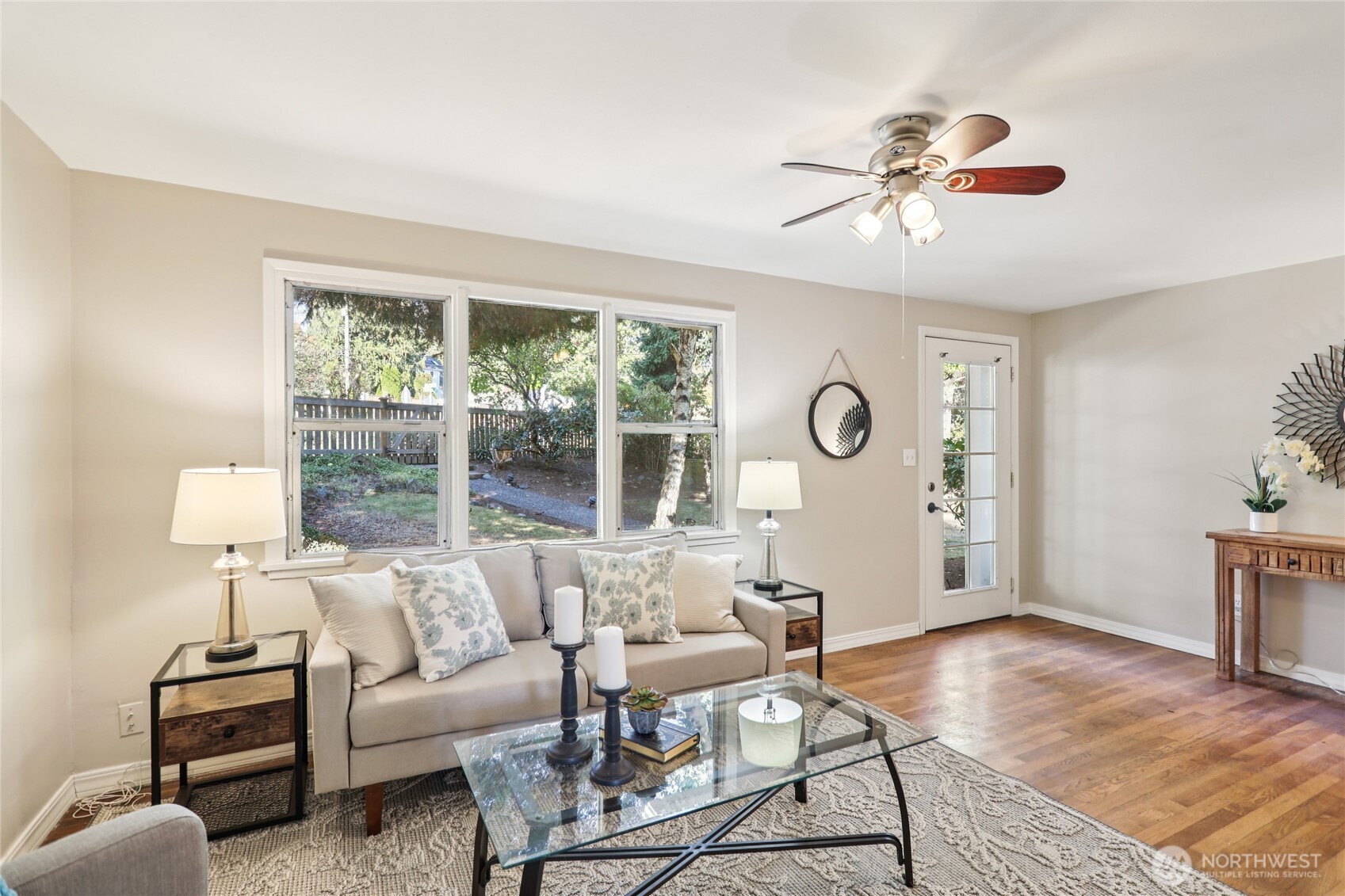 1005 Northeast 170th Street Shoreline, WA 98155 - Photo 4 of 35 a living room with furniture a ceiling fan and a window