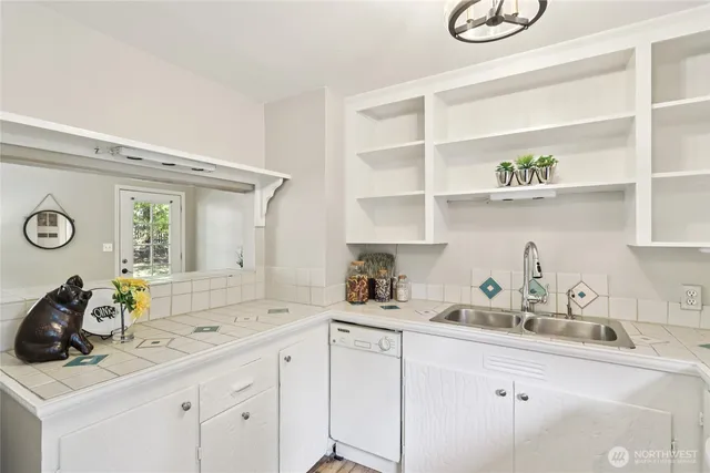 a kitchen with a sink and cabinets