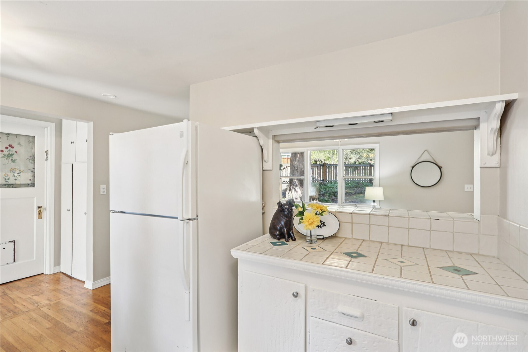 1005 Northeast 170th Street Shoreline, WA 98155 - Photo 8 of 35 a kitchen with a refrigerator and a sink