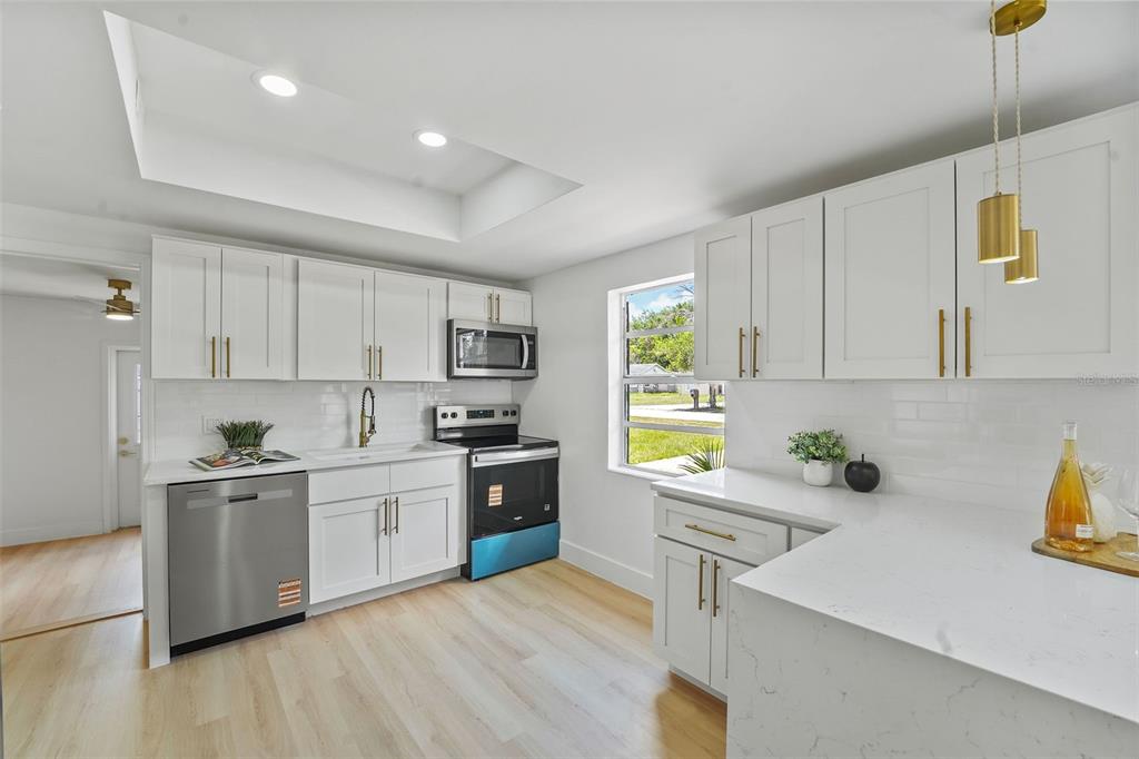 17 Palmira Road DeBary, FL 32713 - Photo 11 of 28 a kitchen with a sink appliances and cabinets