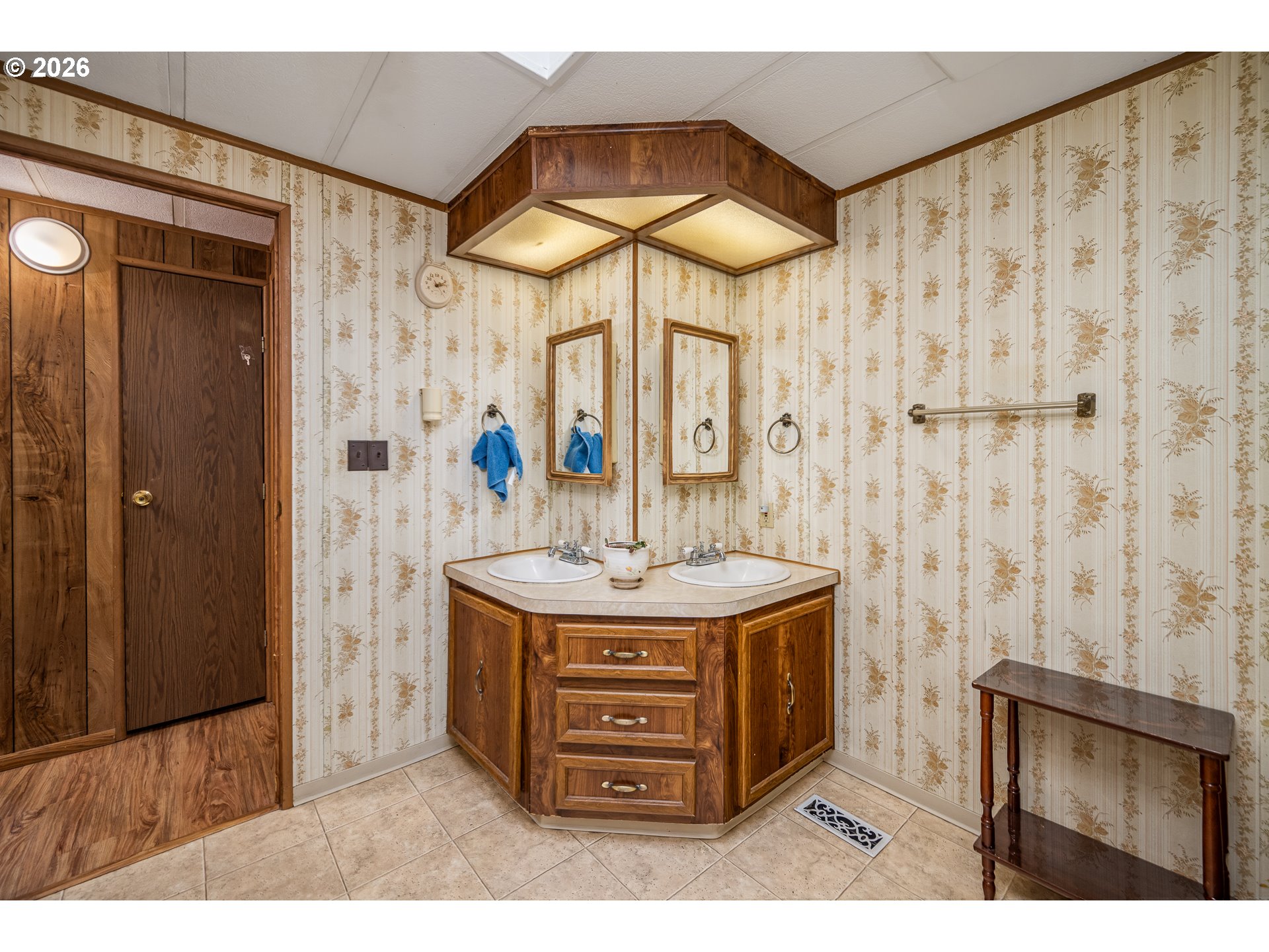 5254 Forsythia Street Springfield, OR 97478 - Photo 11 of 18 a bathroom with a granite countertop sink a mirror and shower