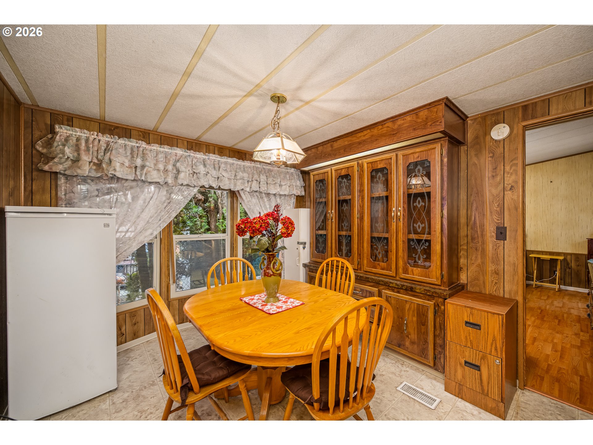 5254 Forsythia Street Springfield, OR 97478 - Photo 7 of 18 a view of a dining room with furniture and chandelier
