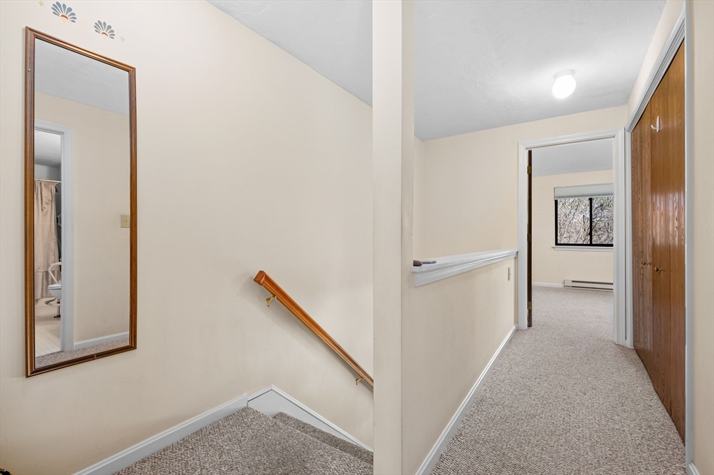 72 Chestnut Circle, Unit 72 Brewster, MA 02631 - Photo 13 of 28 a view of a hallway with closet and bathroom