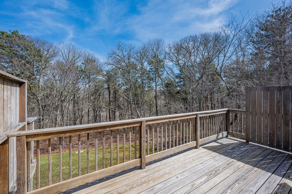 72 Chestnut Circle, Unit 72 Brewster, MA 02631 - Photo 24 of 28 a view of balcony with wooden floor and fence