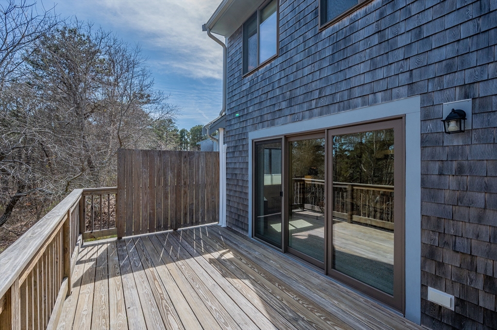 72 Chestnut Circle, Unit 72 Brewster, MA 02631 - Photo 26 of 28 a view of outdoor space with deck and backyard