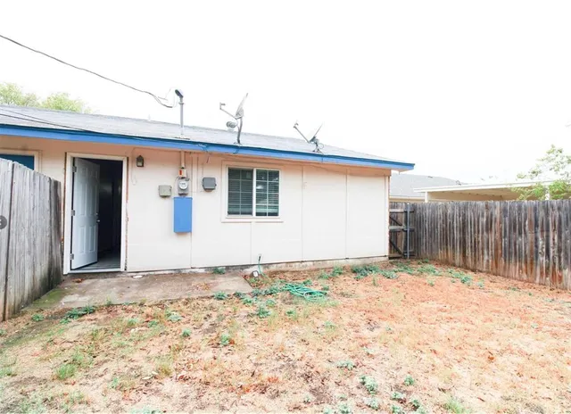 a view of a house with a fence