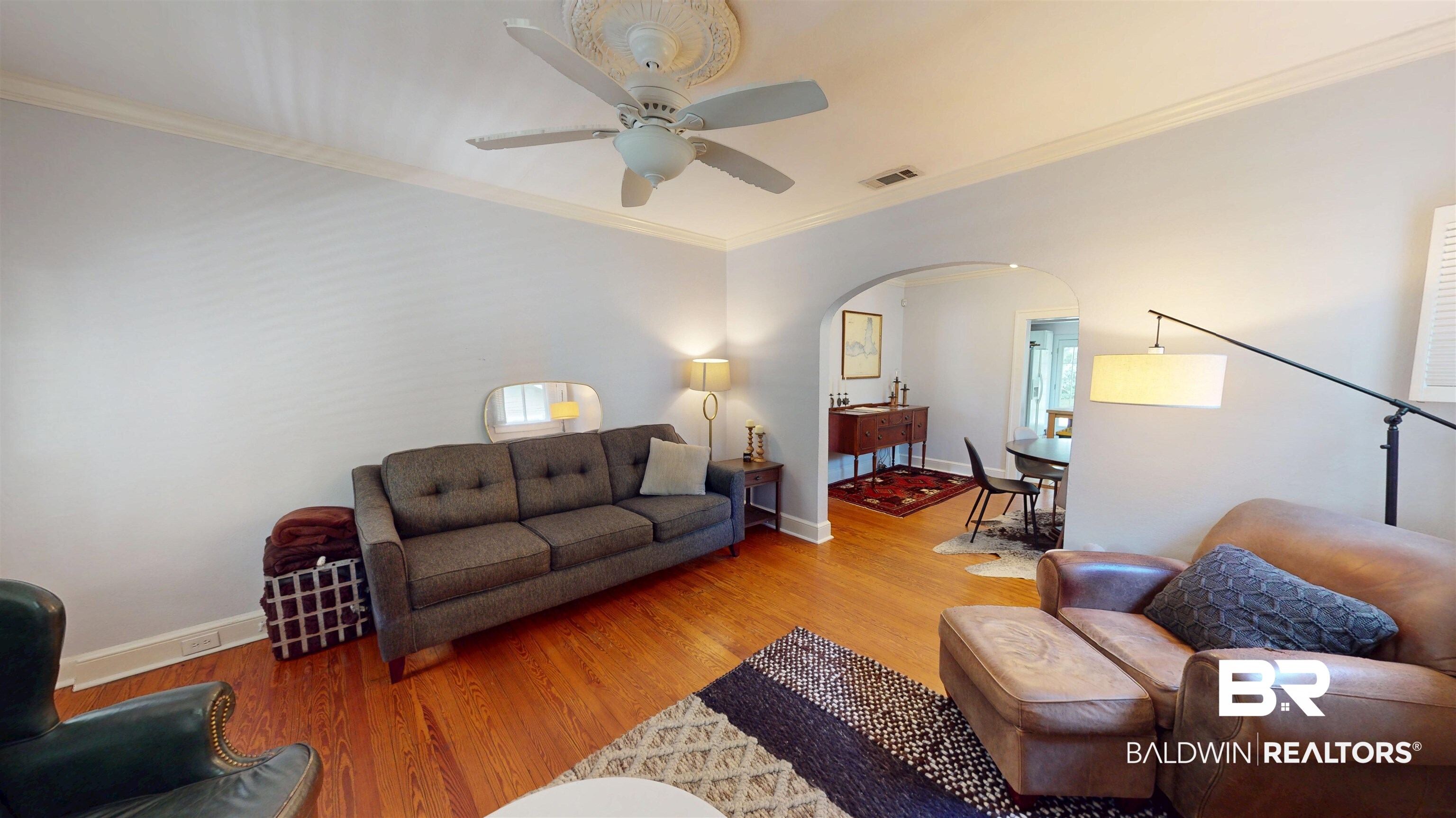 266 Westwood Street Mobile, AL 36606 - Photo 8 of 34 Living area featuring arched walkways, ceiling fan, light wood finished floors, and crown molding